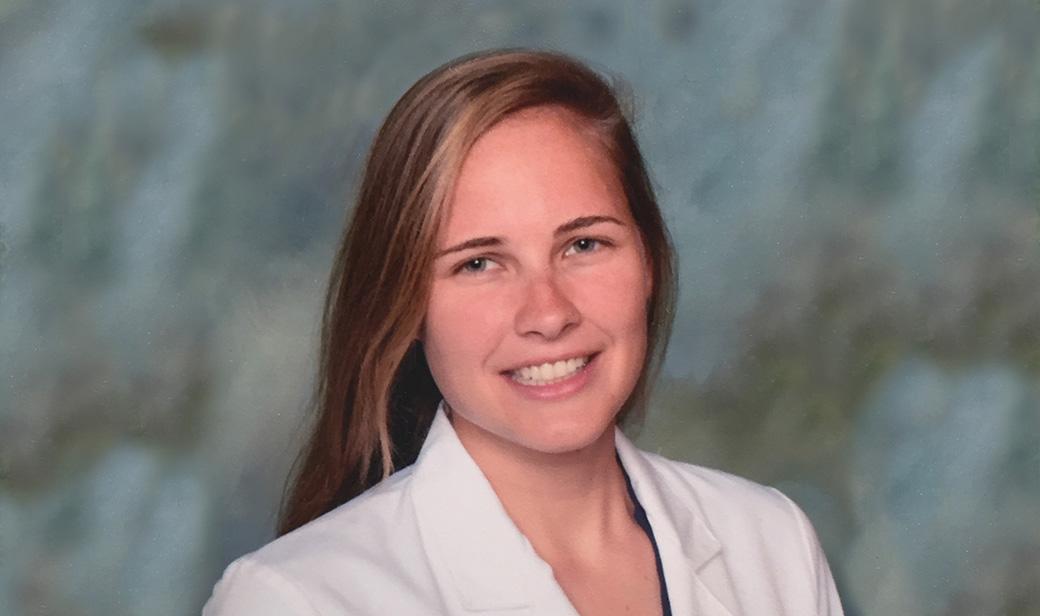 Paige davis, smiling in a white coat, professional portrait
